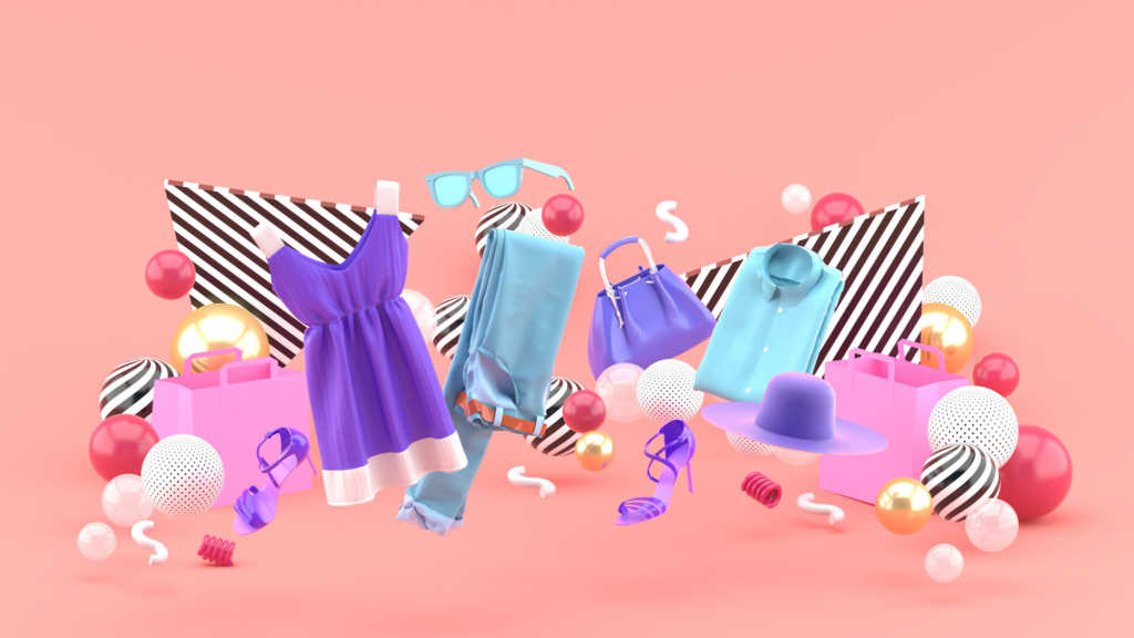 A imagem é uma montagem. Em um fundo rosa, estão dispostas diferentes peças de roupas, como um sapato roxo, um vestido roxo e branco, uma calça jeans, uma bolsa roxa e uma camisa azul. Além de acessórios como um óculos azul e duas bolsas rosas. Elementos gráficos em forma de bolas enfeitam a imagem.